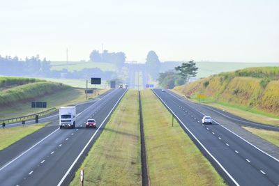 Cars on road against sky