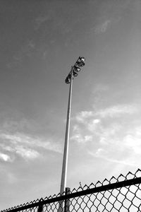 Low angle view of floodlight against sky