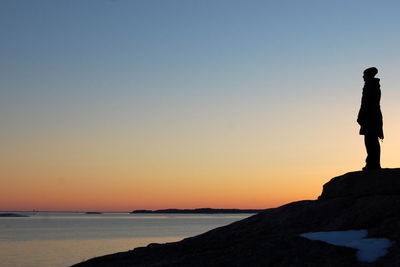 Scenic view of calm sea at sunset