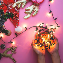 Close-up of hand holding illuminated lighting equipment