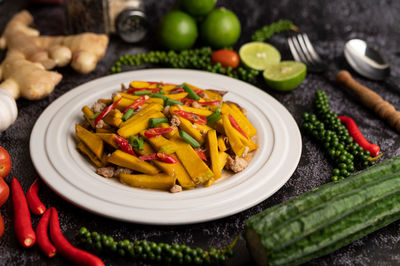 High angle view of vegetables in plate on table