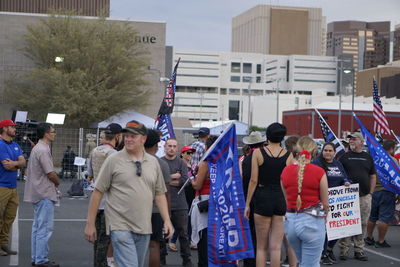 Group of people in front of buildings