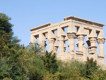 Low angle view of historical building against blue sky