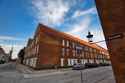 Street amidst buildings against sky in city