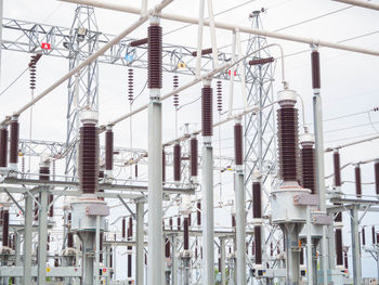 Low angle view of industry against clear sky