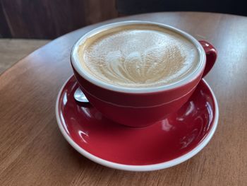 Close-up of cappuccino served on table