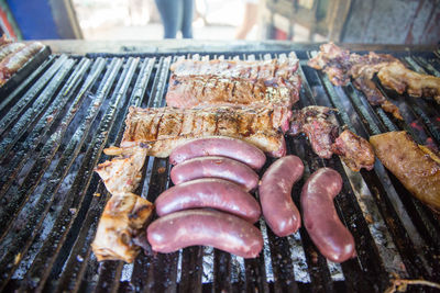 High angle view of meat on barbecue grill