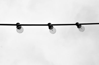 Low angle view of lamp post against sky