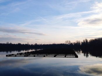 Reflection of trees in calm lake