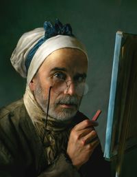 Photo portrait of 21st century is homage to self-portrait by jacques baptiste chardin 18st century