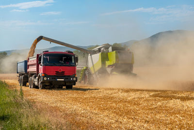 Combine harvester at work during harvest. wheat supply shortage, global food crisis, stockpiling.