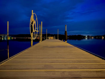 A boat dock on lake winnisquam in mid summer just after dusk.