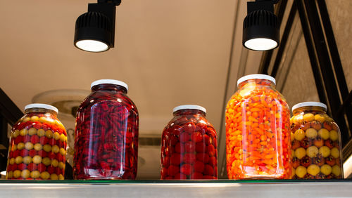 Close-up of illuminated candles on table