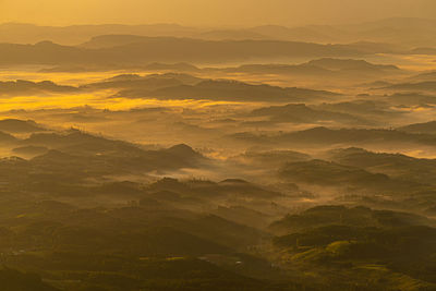 Scenic view of mountains against sky during sunset