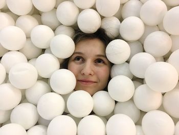 High angle view of woman amidst balloons 