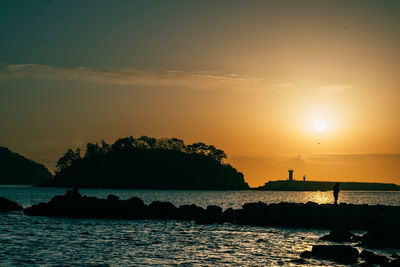 Scenic view of sea against sky during sunset