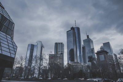 Low angle view of buildings against sky at dusk