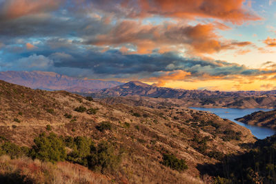 Scenic view of mountains against sky at sunset