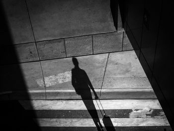 Shadow of people on tiled floor