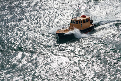 High angle view of ship sailing in sea