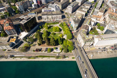 High angle view of swimming pool by buildings in city