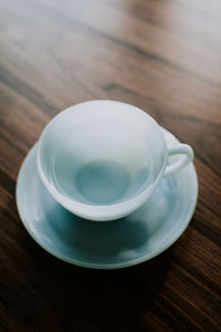 High angle view of empty coffee cup on table