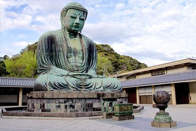 Statue of liberty against cloudy sky