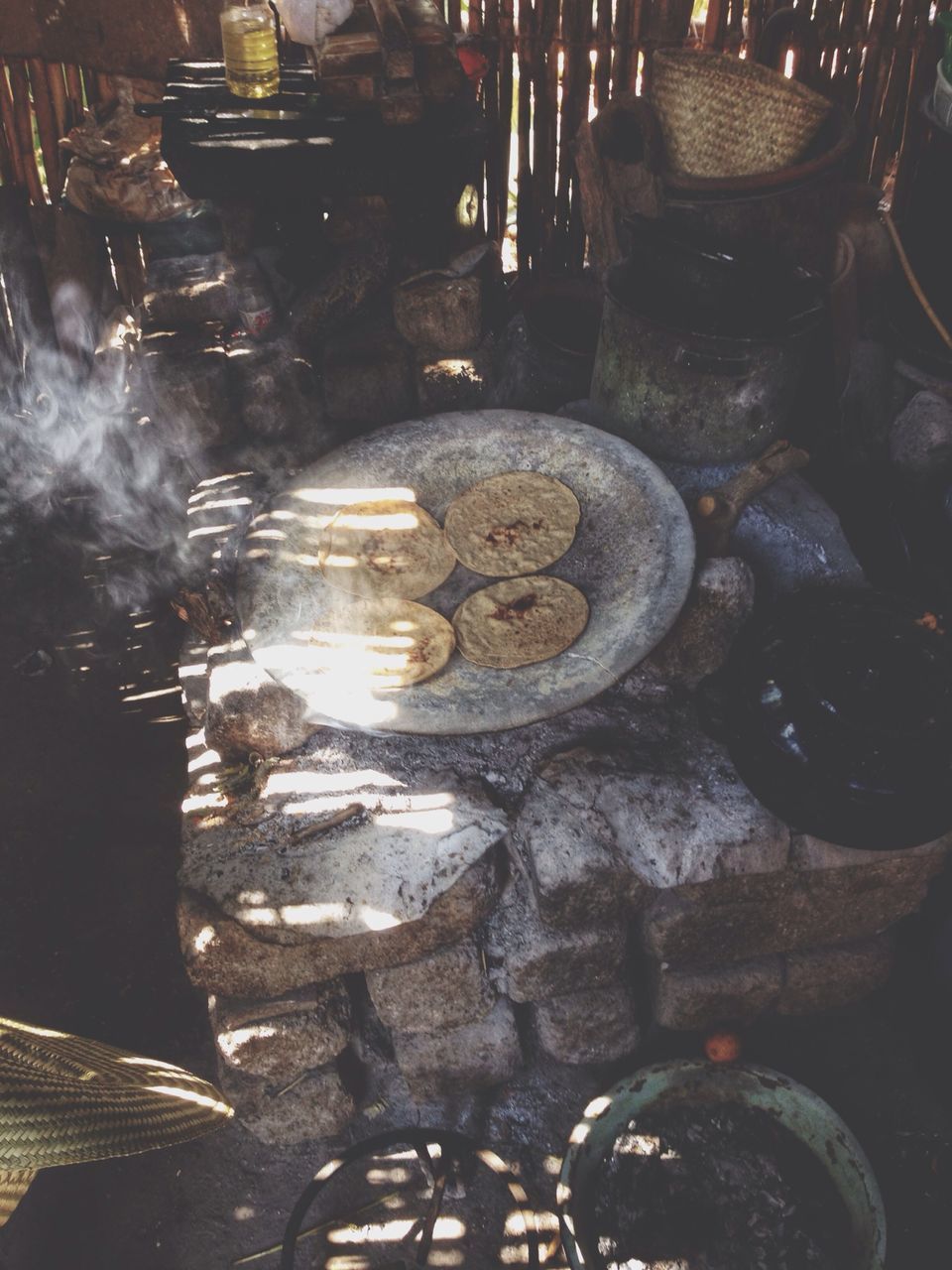 water, reflection, large group of objects, high angle view, indoors, abundance, in a row, no people, sunlight, metal, day, close-up, puddle, illuminated, stack, stone - object, old, wood - material, pattern