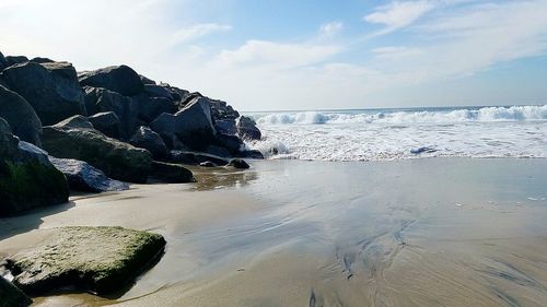 Scenic view of beach against sky