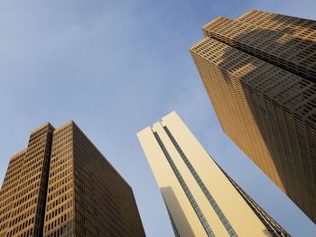 Low angle view of skyscrapers against sky