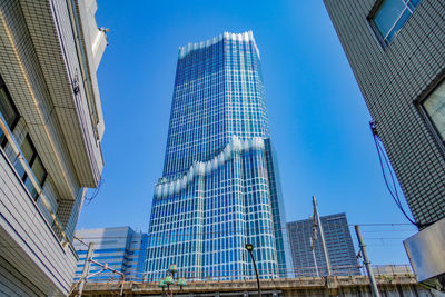 Low angle view of modern buildings against sky