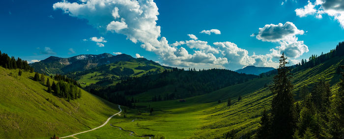 Scenic view of mountains against cloudy sky