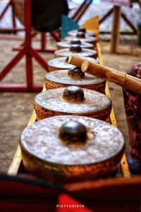 Close-up of rusty metal on table at temple