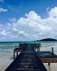 Pier over sea against sky