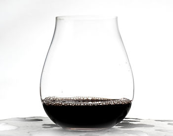Close-up of coffee on table against white background