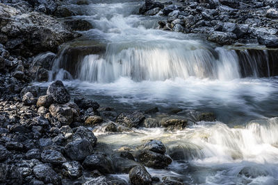 Scenic view of waterfall in forest