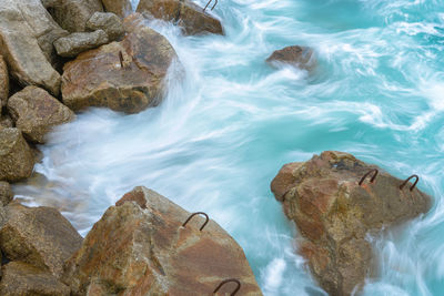 High angle view of rocks in sea