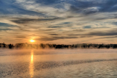 Dramatic sky over calm lake
