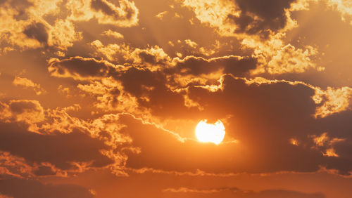 Low angle view of dramatic sky during sunset