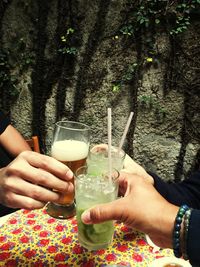 Close-up of hands holding drink