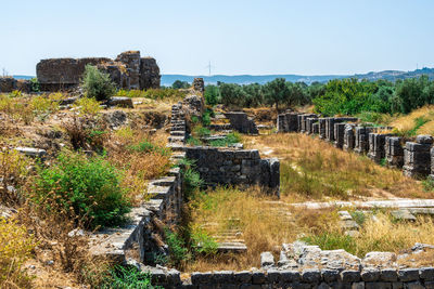 Built structure on landscape against clear sky