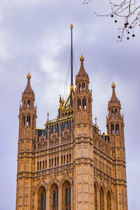 Low angle view of clock tower against sky