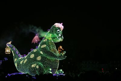 View of illuminated fireworks against sky at night