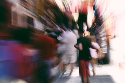 Blurred motion of person walking on road