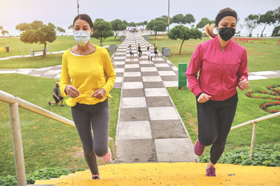 Multiethnic women jogging on the street.