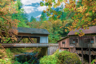 Covered bridge and grist mill with autumn foliage