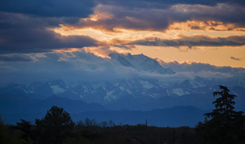 Scenic view of mountains against sky during sunset