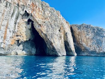 Highland cliffs by sea and blue sky