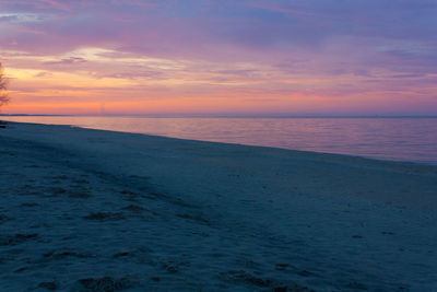 Scenic view of sea against sky at sunset