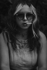 Portrait of woman smoking cigarette